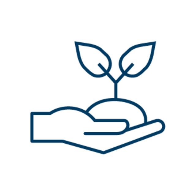 Growing_company Hand hält eine kleine Pflanze mit zwei Blättern